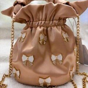 Most Wanted blush colored handbag with bow embellishments NWT